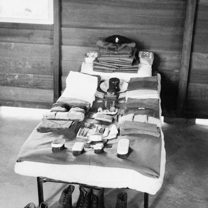 Kit laid out on a barrack bed ready for inspection, 1955