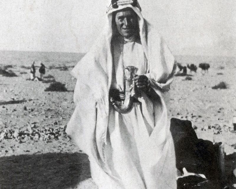 Lawrence in the desert in traditional Arab garb during the First World War