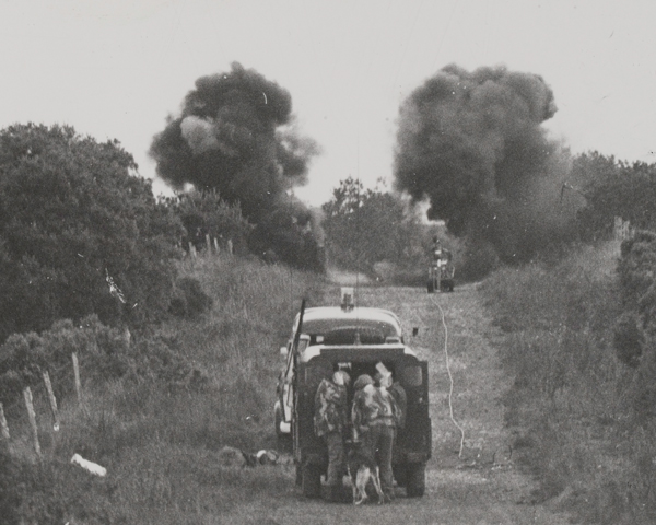 Army disposal officers detonate a device near the Irish border, 1975