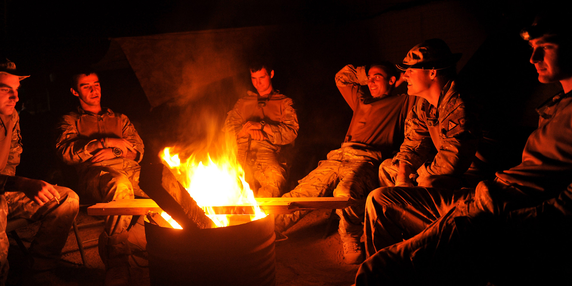 Soldiers round a fire