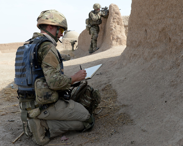 Matthew Cook sketching in Afghanistan