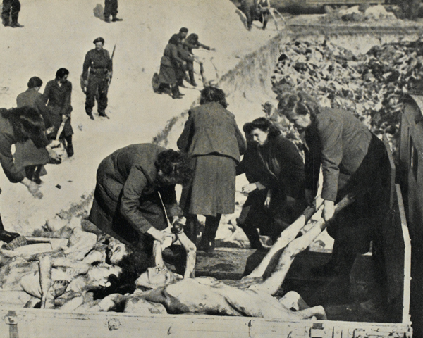 Female SS guards bury their victims at Belsen, April 1945
