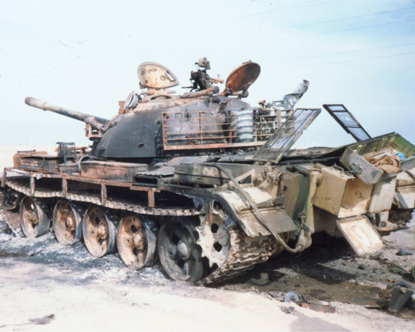 A destroyed Iraqi T-55 tank in the Kuwait desert, 1991