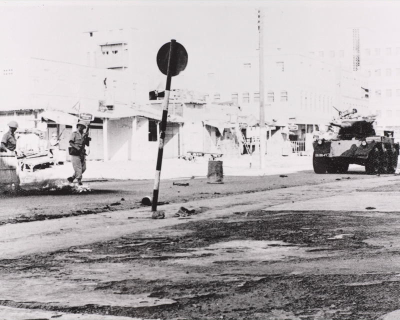 An armoured car patrols the Aden streets during a riot, 1967