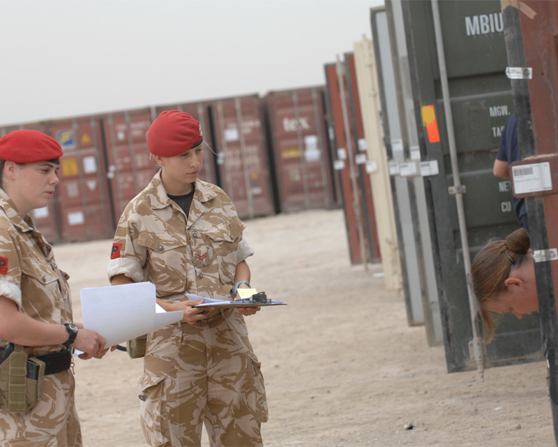 Royal Military Police personnel inspect shipping containers in Iraq, 2005
