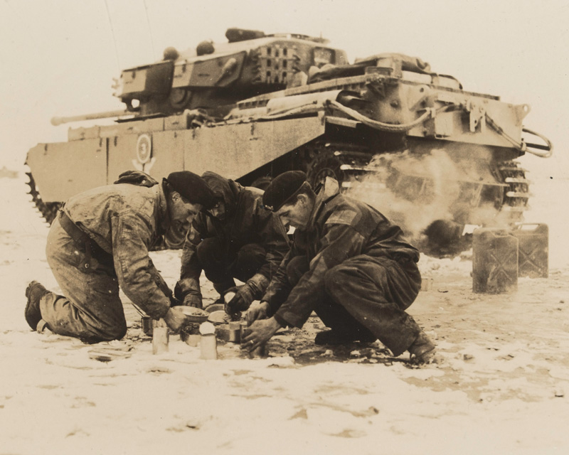 A tank crew from the 8th (King’s Royal Irish) Hussars make a meal during their service on the Imjin, 1951