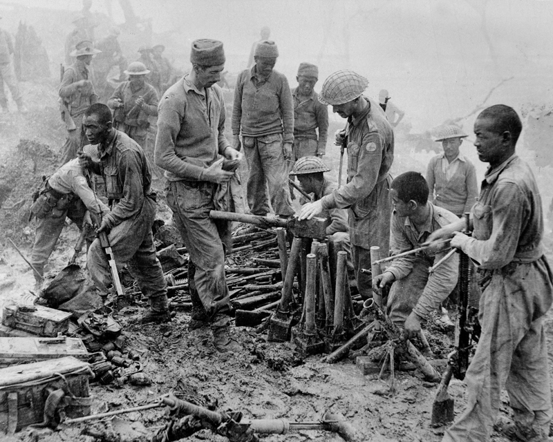 Men of 23rd Indian Division inspect captured Japanese ordnance at Imphal, 1944