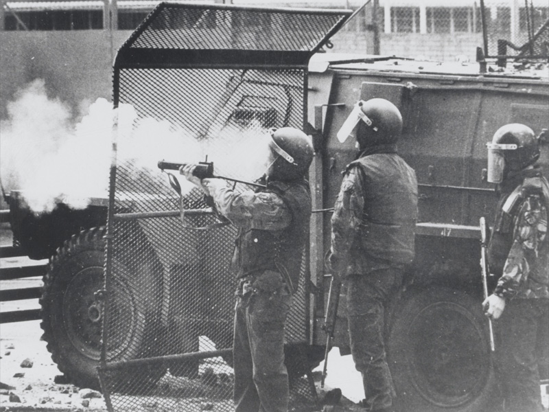 A soldier fires off a baton round, Northern Ireland, 1972