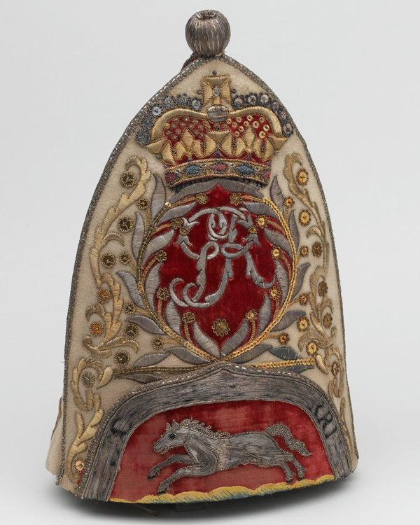This grenadier cap of the 65th Regiment bears the royal cypher and the white horse of Hanover, c1758