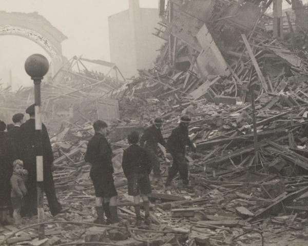 Schoolboys survey bomb damage, London, 18 October 1940