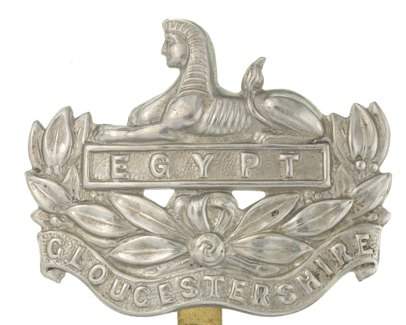Cap badge of The Gloucestershire Regiment depicting a Sphinx