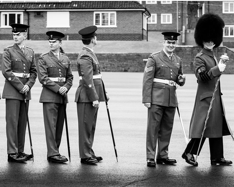 Warrant officers from the Welsh Guards wait to be presented their leeks on St David's Day, 2017