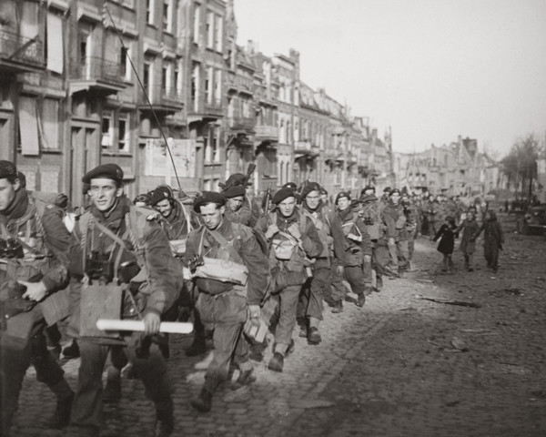 Commandos march through Flushing during the capture of Walcheren, 1944