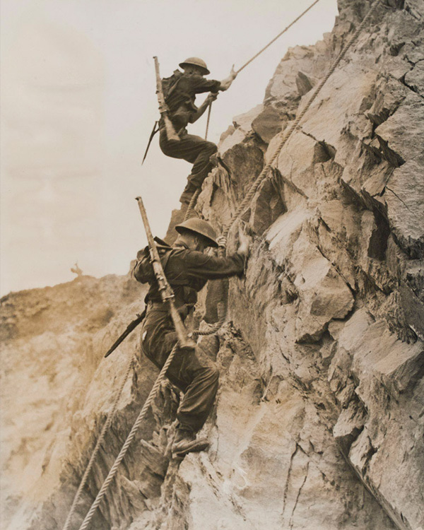 Climbing under live fire at the Commando Battle School, 1944