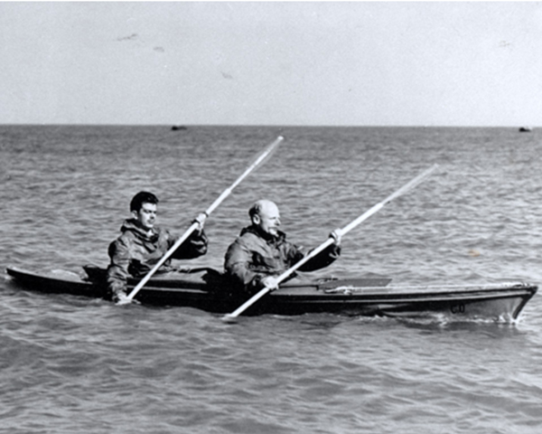 Major Herbert Hasler and a colleague paddling a canoe, c1942