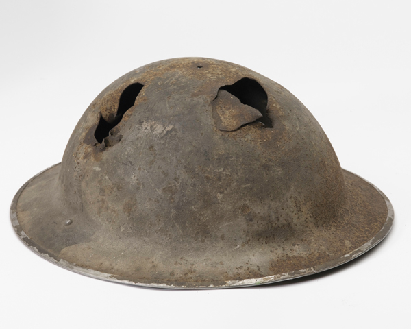 Battle damaged Mk II helmet worn by Sergeant John Knowler during the Dieppe Raid, 1942