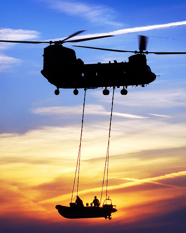 A Chinook lowering an SBS boat