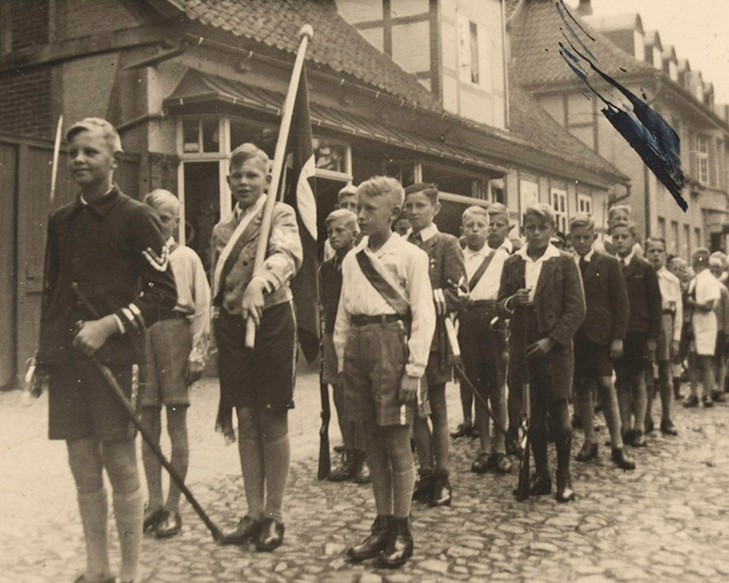 German youth marching under the Nazi banner, c1935