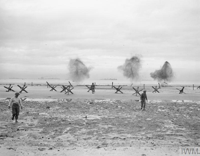 Royal Navy personnel blowing up beach obstacles, Normandy, 1944