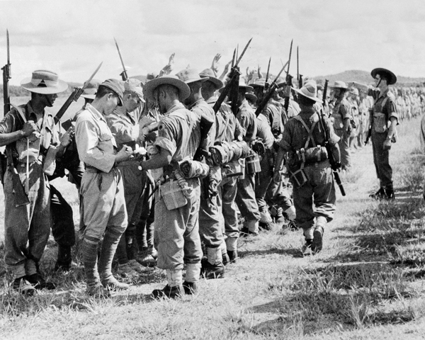 Searching Japanese troops after their surrender in Kuala Lumpur, Malaya, 1945