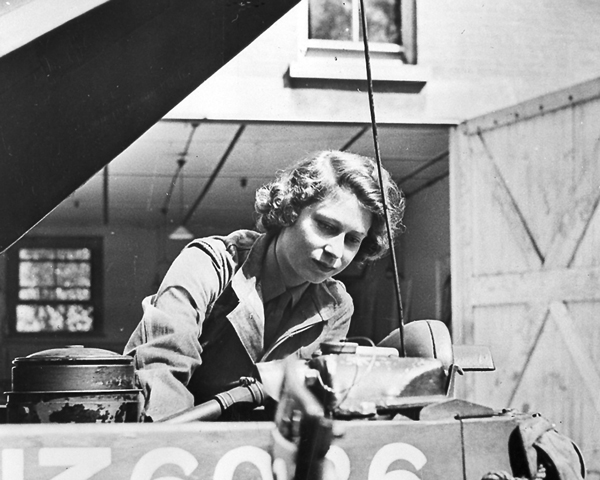 Princess Elizabeth working on a car engine, 1945