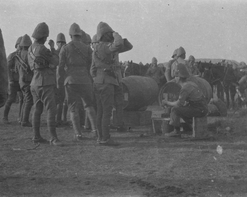 Members of the 18th Hussars enjoy a beer at Zand Spruit, South Africa, 1900