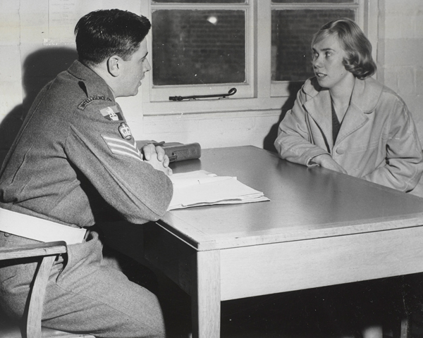 An Intelligence Corps warrant officer questioning a civilian, c1960