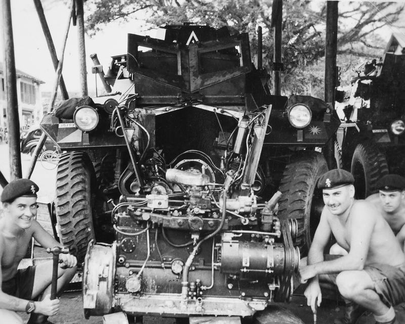 REME craftsmen repairing the engine of a Saracen armoured car, Malaya, 1957