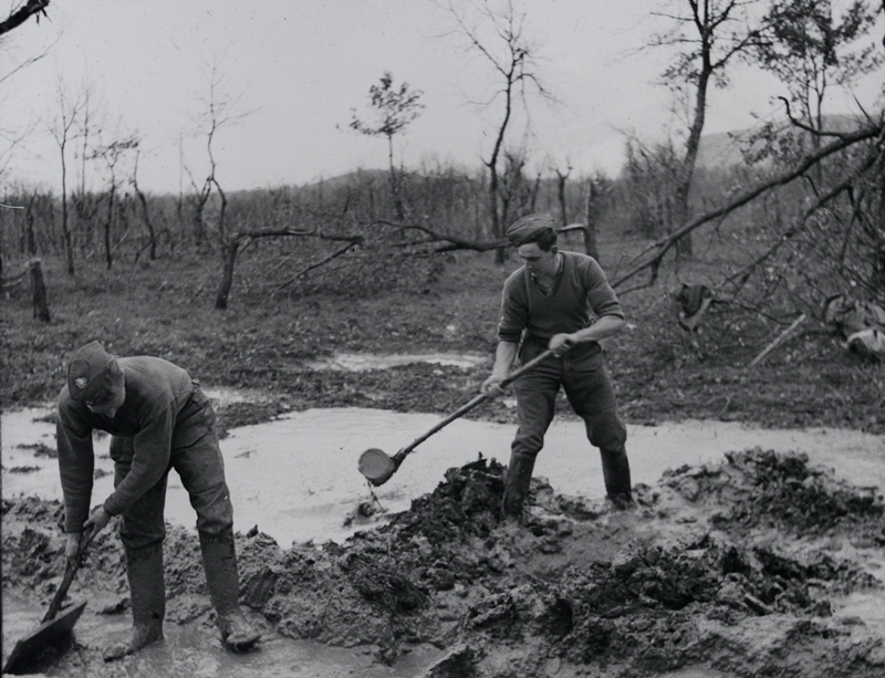 Clearing mud from the forward positions of the 1st East Surrey Regiment on the Rapido River, Italy, 1944