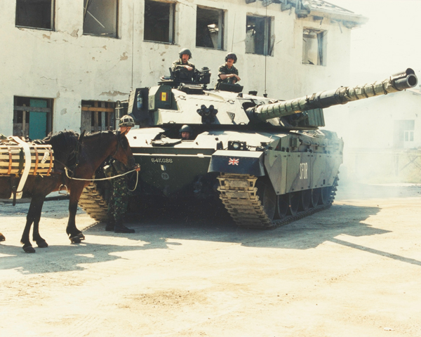 A King's Royal Hussars Challenger tank alongside pack horses, Bosnia, 1997