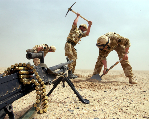Soldiers dig in during the journey north into Iraq, March 2003 