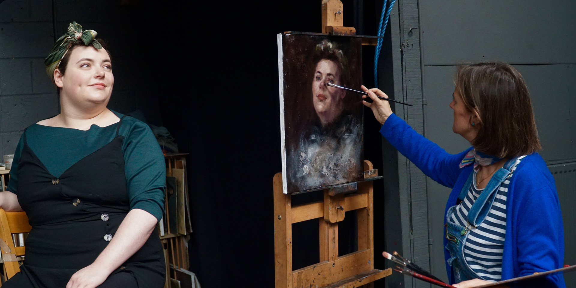 Ann Witheridge of London Fine Art Studios painting a woman's portrait