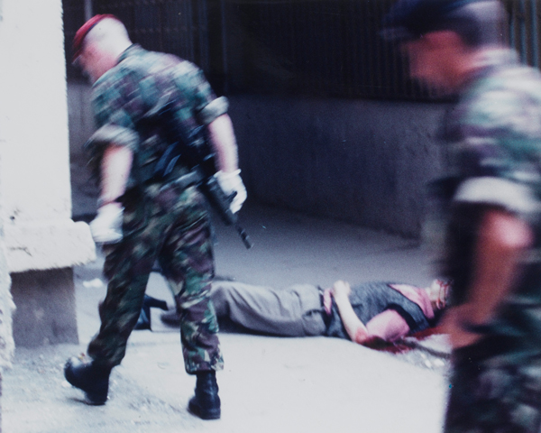 The Royal Military Police at the scene of a murder of a Serbian civilian by an Albanian Kosovan, Pristina, 1999