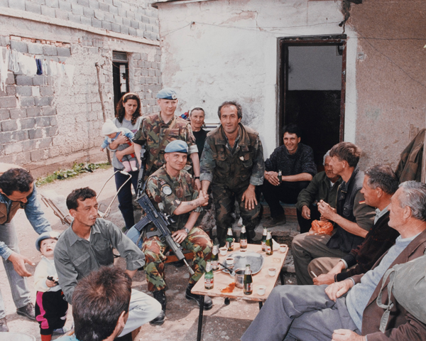 Members of The Royal Anglian Regiment meet Bosnian villagers, c1993