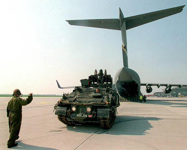 British Army vehicles disembark from transport aircraft, Macedonia, 1999