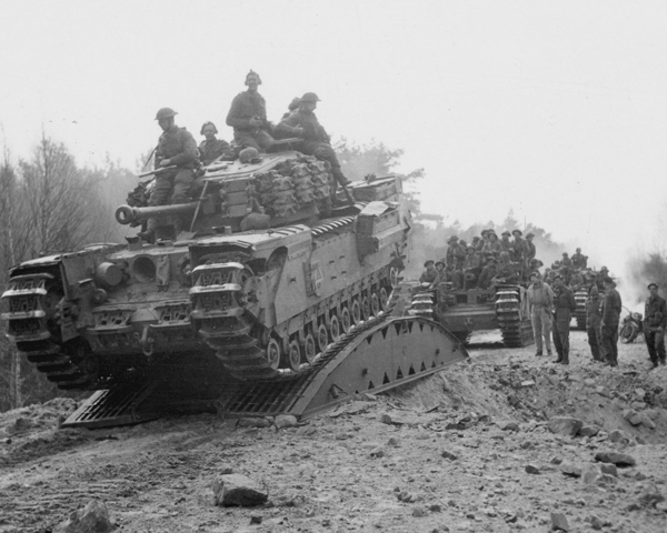 Tanks cross a bridged crater during the advance to the Elbe, April 1945