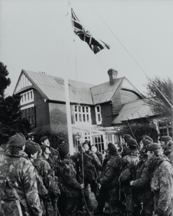Royal Marine Commandos hoisting the original Union Jack at Government House, Port Stanley, June 1982