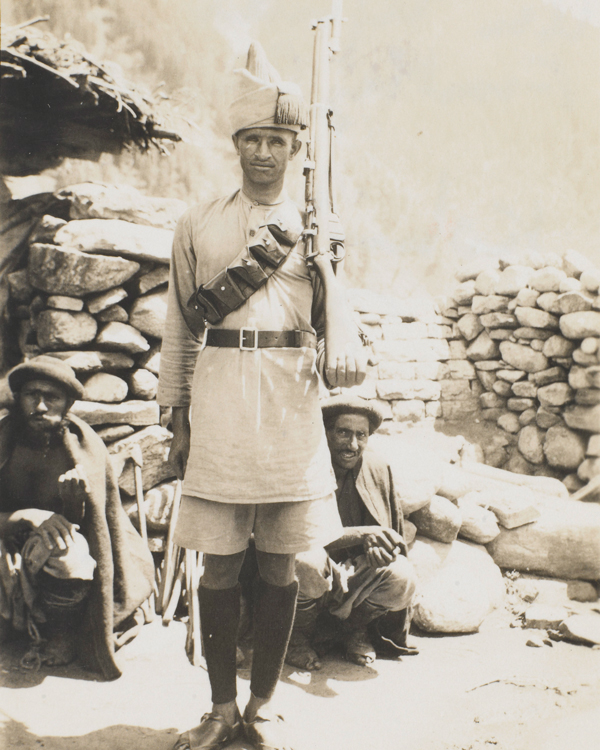 An Afridi of the Frontier Constabulary with Kohistani prisoners, 1934