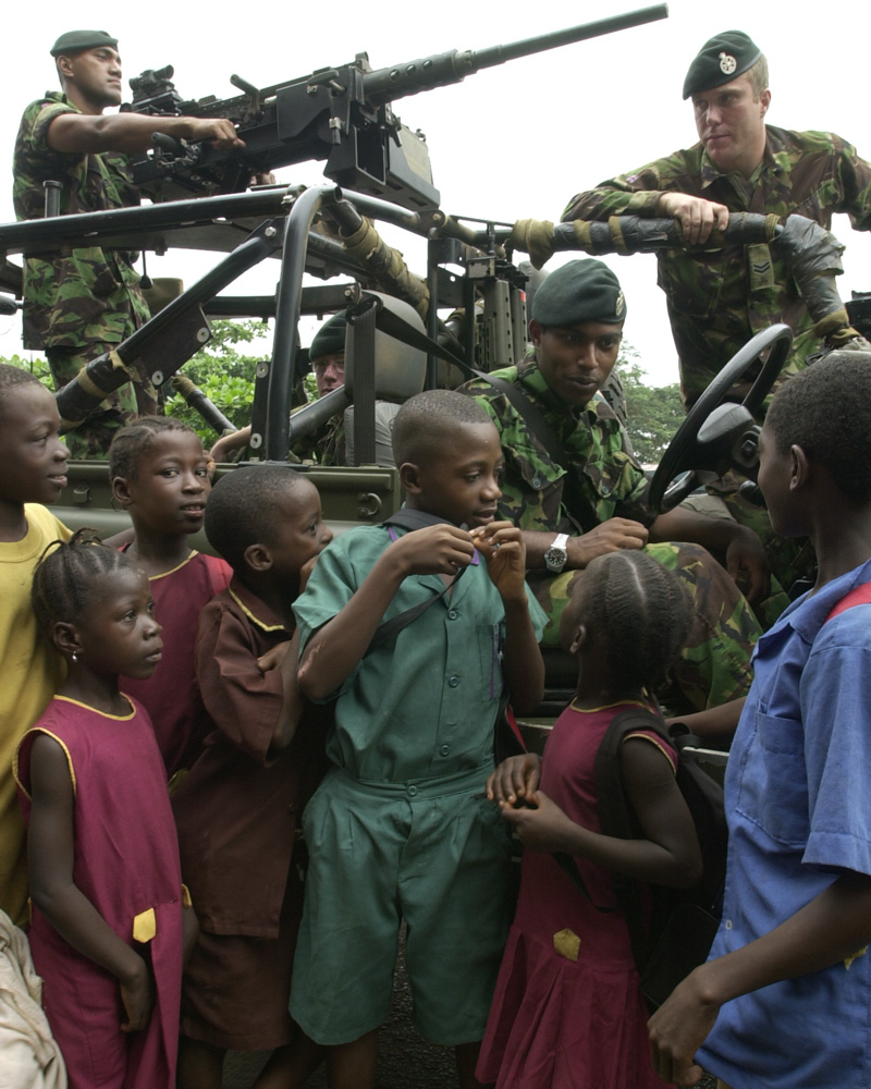 British soldiers with civilians in Sierra Leone, 2001