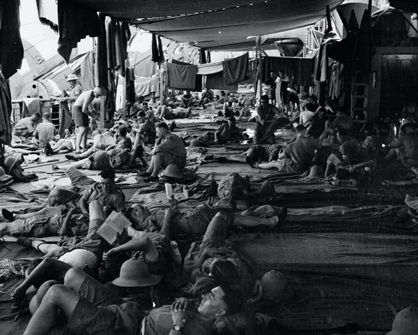 Airing blankets on the troop deck of HMT 'Orion', 1941