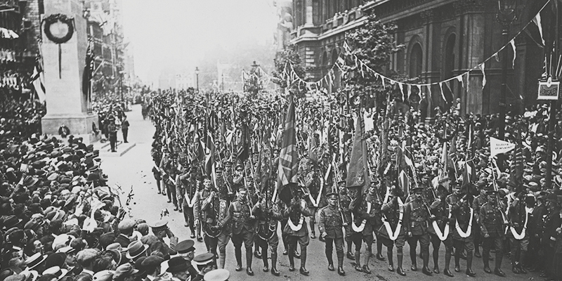 Soldiers march past newly erected Cenotaph on Peace Day, 19 July 1919