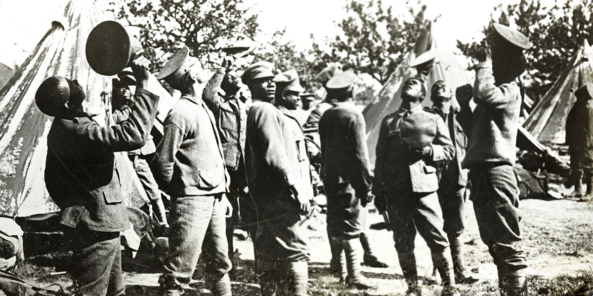 Members of the British West Indies Regiment watching aircraft, 1918