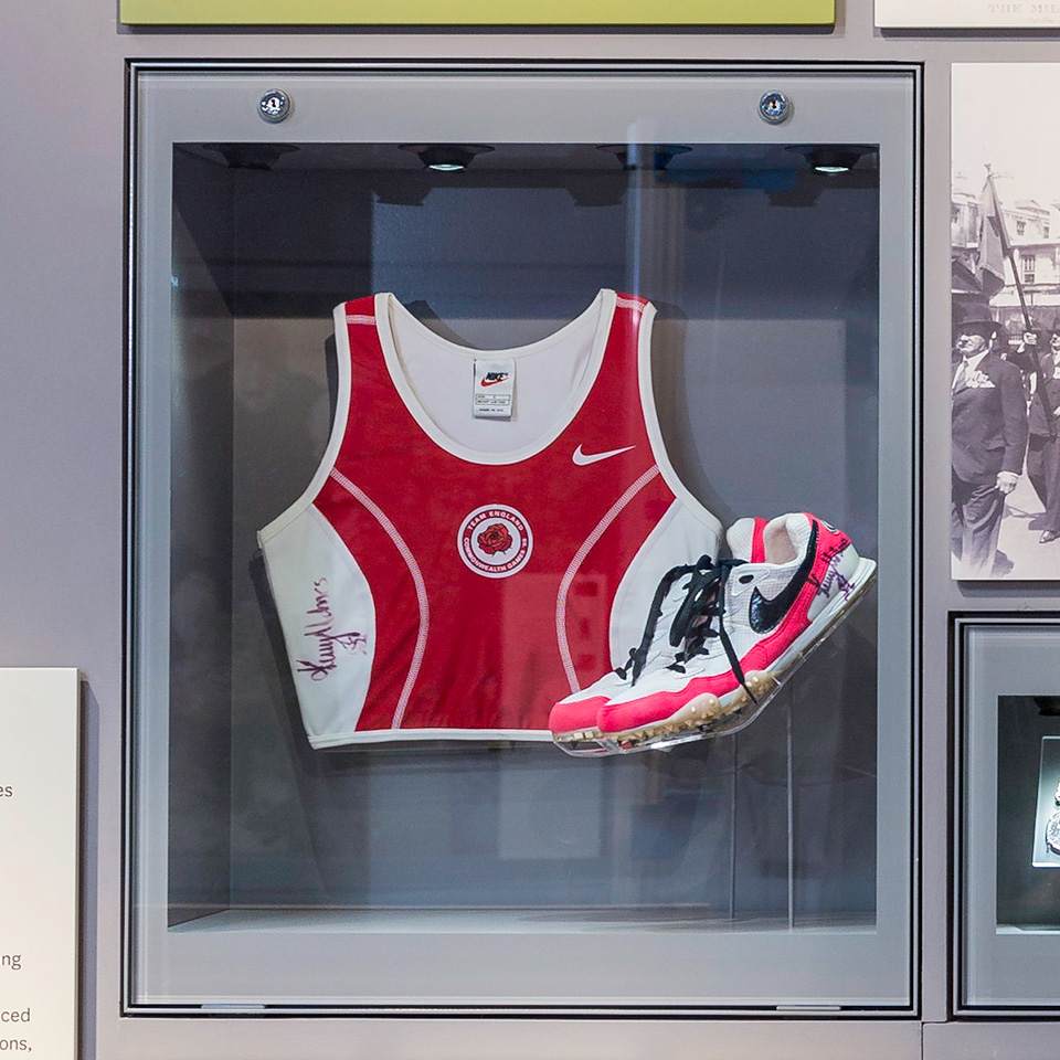 British Army physical training shirt and running shoes worn by Kelly Holmes, c1998