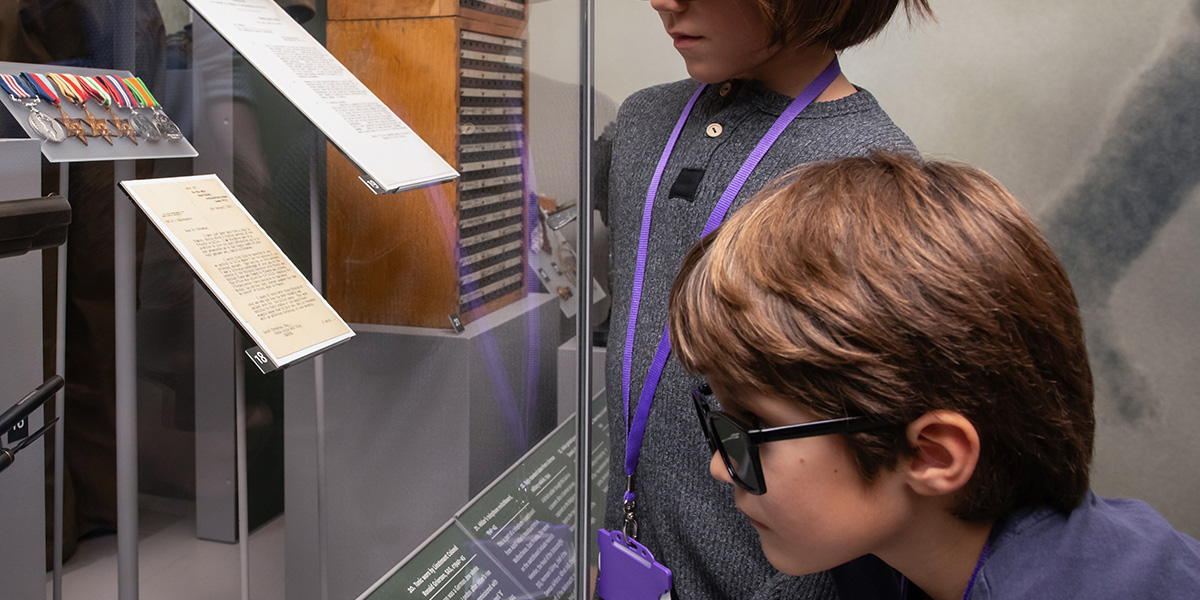 Children examining a gallery exhibit