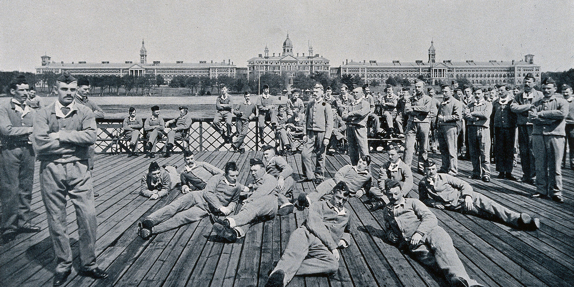 Soldiers relaxing by Southampton Water with Netley Hospital in the background, c1902
