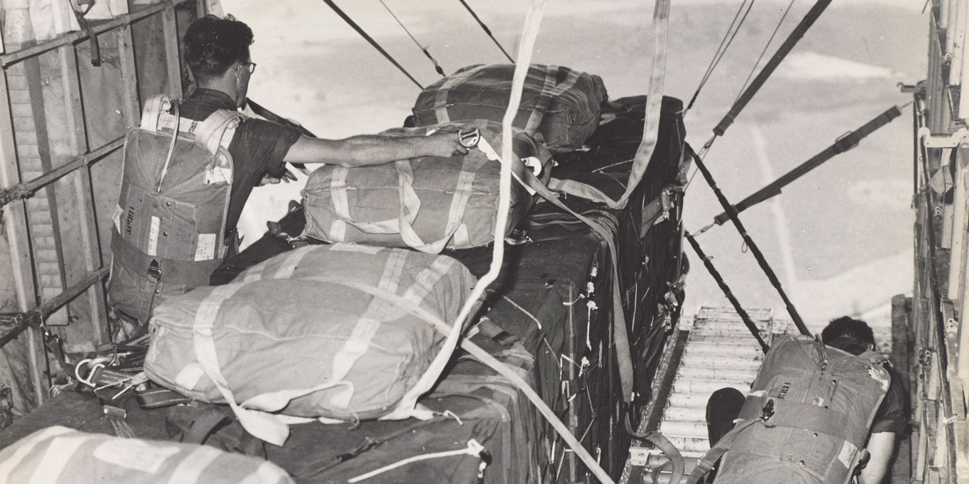 Men of an Air Despatch Company prepare to launch supplies from an aircraft during a parachute drop in Kenya, c1950-69