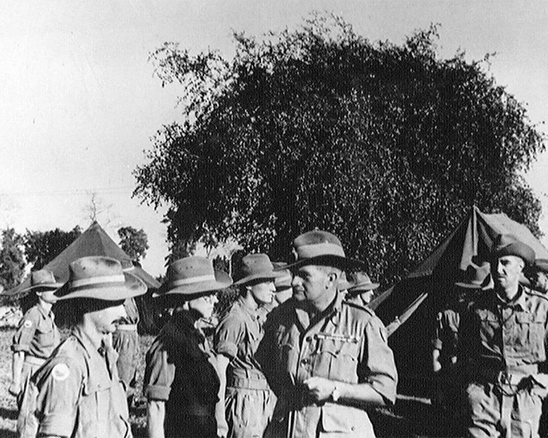 Lieutenant-General Sir William Slim (second right) meets members of 11th (East African) Division in Burma, 1945