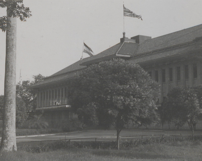 Dutch and British flags flying side by side on an official building, Indonesia, c1945