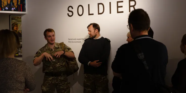 A soldier leading a tour of Soldier gallery