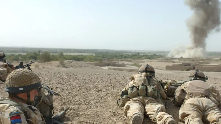 British soldiers watching the bombing of an enemy position in Musa Qala, 2006